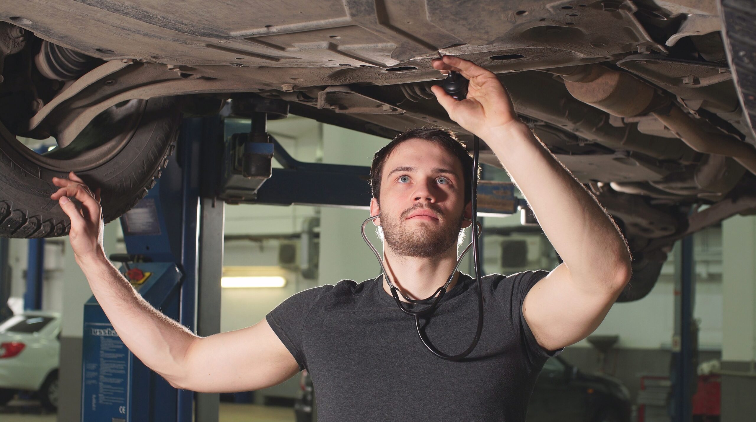 A strut and a wheel bearing on the bench, two of the parts most likely to need replacing once a car clears 150,000 miles.